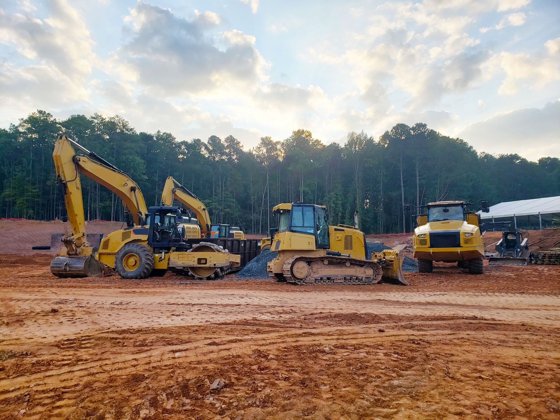 Dirt Construction Site with Heavy Equipment, Bulldozer, Dump truck